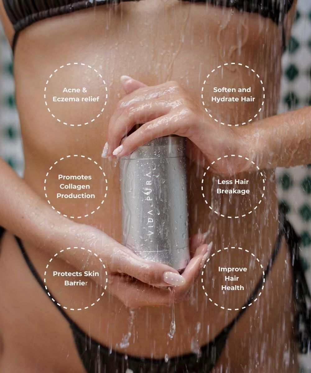 Vida Pura Shower Filter held under running water for skin and hair hydration benefits