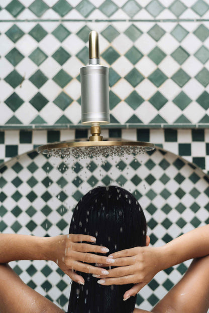 The Vida Pura Shower Filter on an outdoor shower