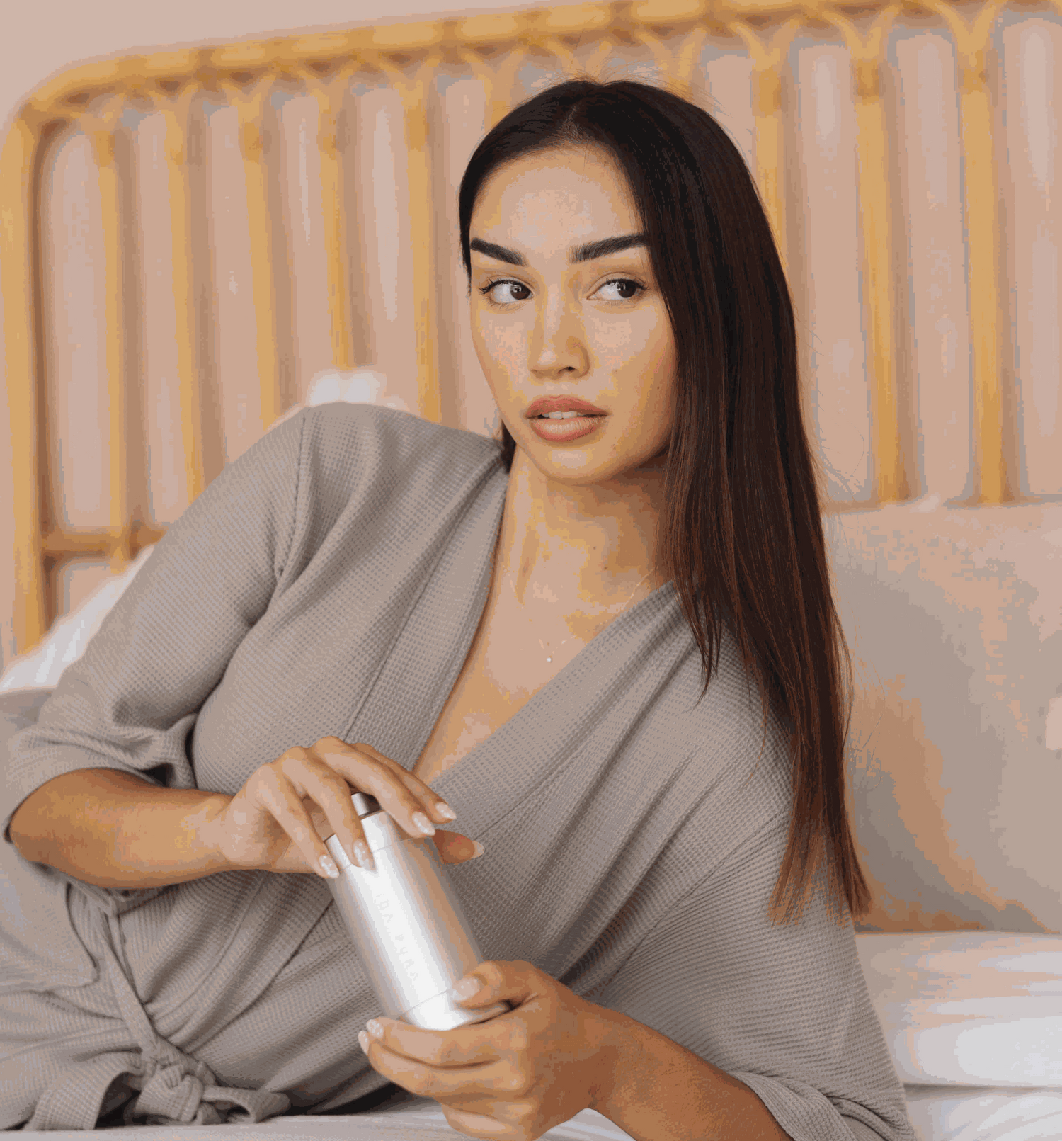 Model holding Vida Pura Shower Filter